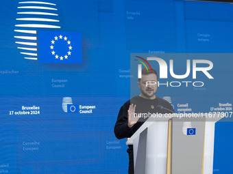 President of Ukraine Volodymyr Zelenskyy addresses a press conference during his visit at the European Council Summit, the EU leaders meetin...