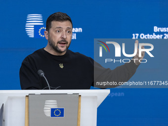 President of Ukraine Volodymyr Zelenskyy addresses a press conference during his visit at the European Council Summit, the EU leaders meetin...