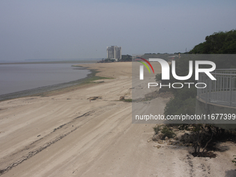 A historic drought occurs on the Negro River, seen from the Ponta Negra neighborhood in Manaus, Amazonas, Brazil, on October 13, 2024. (