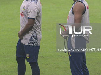 Bangladeshi cricketers Zakir Hasan (L) and Mehidy Hasan Miraz attend a practice session at the Sher-e-Bangla National Cricket Stadium in Dha...