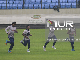 Bangladeshi cricketers attend a practice session at the Sher-e-Bangla National Cricket Stadium in Dhaka, Bangladesh, on October 18, 2024, ah...