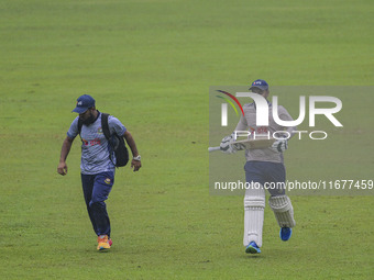 Bangladeshi cricketer Liton Das (R) attends a practice session at the Sher-e-Bangla National Cricket Stadium in Dhaka, Bangladesh, on Octobe...