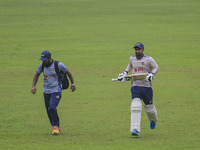 Bangladeshi cricketer Liton Das (R) attends a practice session at the Sher-e-Bangla National Cricket Stadium in Dhaka, Bangladesh, on Octobe...