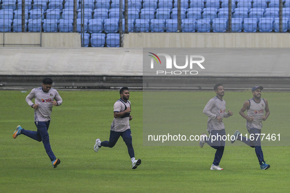 Bangladeshi cricketers attend a practice session at the Sher-e-Bangla National Cricket Stadium in Dhaka, Bangladesh, on October 18, 2024, ah...