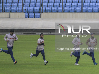 Bangladeshi cricketers attend a practice session at the Sher-e-Bangla National Cricket Stadium in Dhaka, Bangladesh, on October 18, 2024, ah...