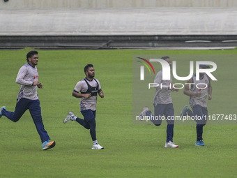 Bangladeshi cricketers attend a practice session at the Sher-e-Bangla National Cricket Stadium in Dhaka, Bangladesh, on October 18, 2024, ah...