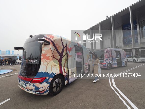 Viewers visit autonomous vehicles at the 2024 World Intelligent Connected Vehicle Conference in Beijing, China, on October 18, 2024. 