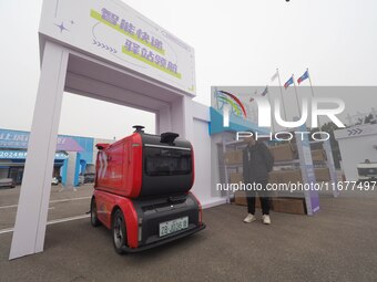 The audience visits the ''JD Autonomous Delivery Vehicle'' at the 2024 World Intelligent Connected Vehicle Conference in Beijing, China, on...