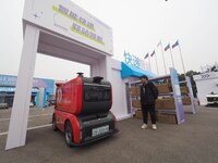 The audience visits the ''JD Autonomous Delivery Vehicle'' at the 2024 World Intelligent Connected Vehicle Conference in Beijing, China, on...