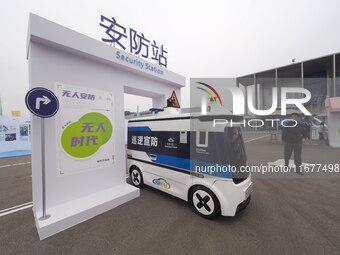 The audience visits the ''Autonomous Patrol and Defense Vehicle'' at the 2024 World Intelligent Connected Vehicle Conference in Beijing, Chi...