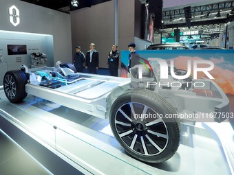 The audience visits the chassis structure model of new energy vehicles at the 2024 World Intelligent Connected Vehicle Conference in Beijing...