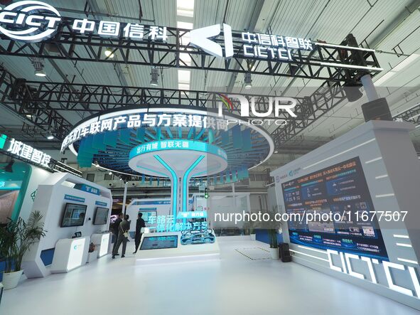 The audience visits the China Information Communication Technologies booth at the 2024 World Intelligent Connected Vehicle Conference in Bei...