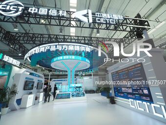 The audience visits the China Information Communication Technologies booth at the 2024 World Intelligent Connected Vehicle Conference in Bei...