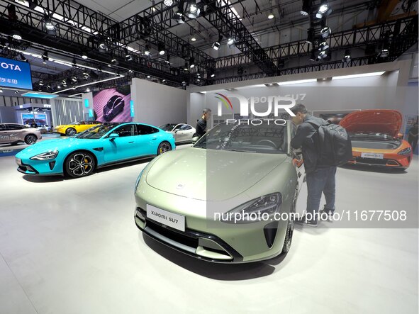 The audience visits the Xiaomi car booth at the 2024 World Intelligent Connected Vehicle Conference in Beijing, China, on October 18, 2024. 