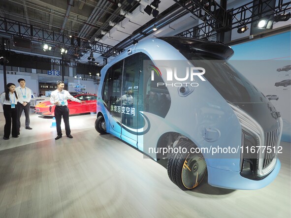 The audience visits the ''Hongqi Intelligent Bus'' at the 2024 World Intelligent Connected Vehicle Conference in Beijing, China, on October...