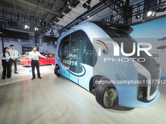 The audience visits the ''Hongqi Intelligent Bus'' at the 2024 World Intelligent Connected Vehicle Conference in Beijing, China, on October...