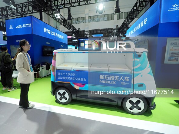 The audience visits the ''unmanned retail ice cream truck'' at the 2024 World Intelligent Connected Vehicle Conference in Beijing, China, on...