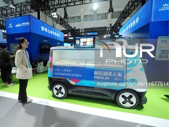 The audience visits the ''unmanned retail ice cream truck'' at the 2024 World Intelligent Connected Vehicle Conference in Beijing, China, on...