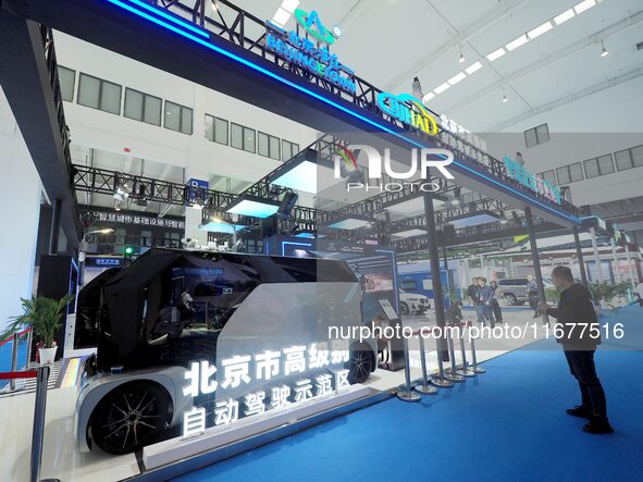 The audience visits the Yizhuang booth in Beijing, China, on October 18, 2024, at the 2024 World Intelligent Connected Vehicle Conference. 