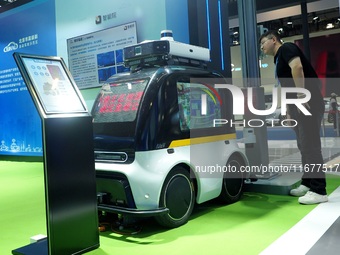 The audience visits the ''Autonomous Driving AI Inspection Vehicle'' at the 2024 World Intelligent Connected Vehicle Conference in Beijing,...