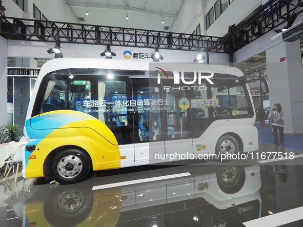 The audience visits the integrated autonomous driving bus at the 2024 World Intelligent Connected Vehicle Conference in Beijing, China, on O...