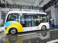 The audience visits the integrated autonomous driving bus at the 2024 World Intelligent Connected Vehicle Conference in Beijing, China, on O...