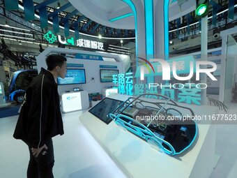 The audience visits the integrated solution exhibition at the 2024 World Intelligent Connected Vehicle Conference in Beijing, China, on Octo...