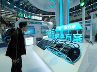 The audience visits the integrated solution exhibition at the 2024 World Intelligent Connected Vehicle Conference in Beijing, China, on Octo...