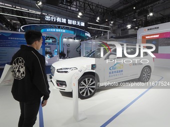 The audience visits the Didi autonomous driving sedan at the 2024 World Intelligent Connected Vehicle Conference in Beijing, China, on Octob...