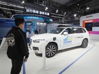 The audience visits the Didi autonomous driving sedan at the 2024 World Intelligent Connected Vehicle Conference in Beijing, China, on Octob...