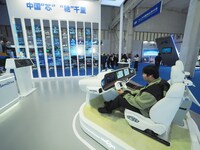 Viewers experience the intelligent cockpit at the 2024 World Intelligent Connected Vehicle Conference in Beijing, China, on October 18, 2024...