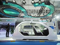 Viewers visit intelligent car models at the 2024 World Intelligent Connected Vehicle Conference in Beijing, China, on October 18, 2024. (