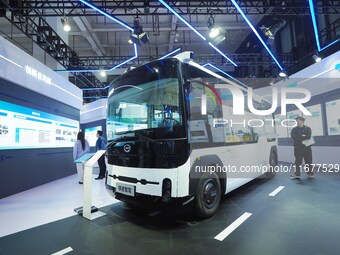 The audience visits the integrated autonomous driving minibus at the 2024 World Intelligent Connected Vehicle Conference in Beijing, China,...