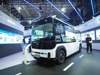 The audience visits the integrated autonomous driving minibus at the 2024 World Intelligent Connected Vehicle Conference in Beijing, China,...