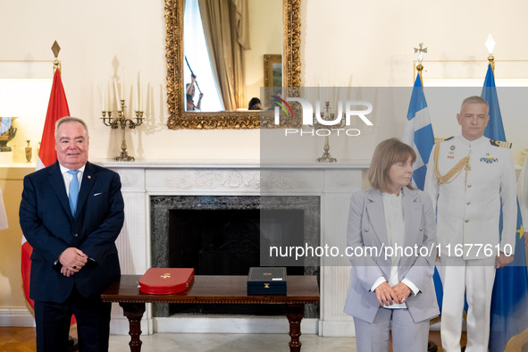 Grand Master and head of the Sovereign Military Order of Malta, Fra' John Timothy Dunlap (L), and Greek President Katerina Sakellaropoulou (...