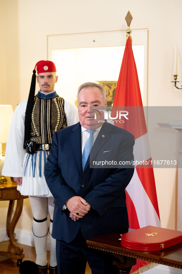 Grand Master and head of the Sovereign Military Order of Malta, Fra' John Timothy Dunlap, and Greek President Katerina Sakellaropoulou excha...