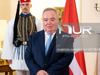 Grand Master and head of the Sovereign Military Order of Malta, Fra' John Timothy Dunlap, and Greek President Katerina Sakellaropoulou excha...