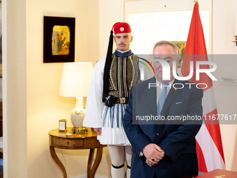 Grand Master and head of the Sovereign Military Order of Malta, Fra' John Timothy Dunlap, and Greek President Katerina Sakellaropoulou excha...