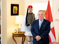 Grand Master and head of the Sovereign Military Order of Malta, Fra' John Timothy Dunlap, and Greek President Katerina Sakellaropoulou excha...