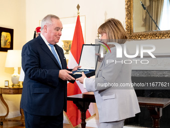 Grand Master and head of the Sovereign Military Order of Malta, Fra' John Timothy Dunlap (L), and Greek President Katerina Sakellaropoulou (...