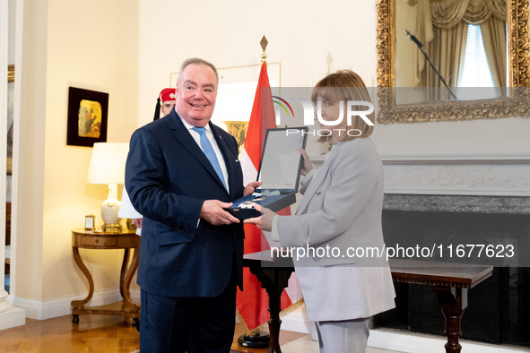 Grand Master and head of the Sovereign Military Order of Malta, Fra' John Timothy Dunlap (L), and Greek President Katerina Sakellaropoulou (...