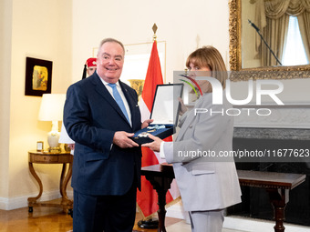 Grand Master and head of the Sovereign Military Order of Malta, Fra' John Timothy Dunlap (L), and Greek President Katerina Sakellaropoulou (...