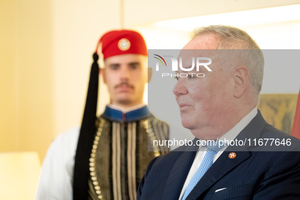 Grand Master and head of the Sovereign Military Order of Malta, Fra' John Timothy Dunlap, and Greek President Katerina Sakellaropoulou excha...