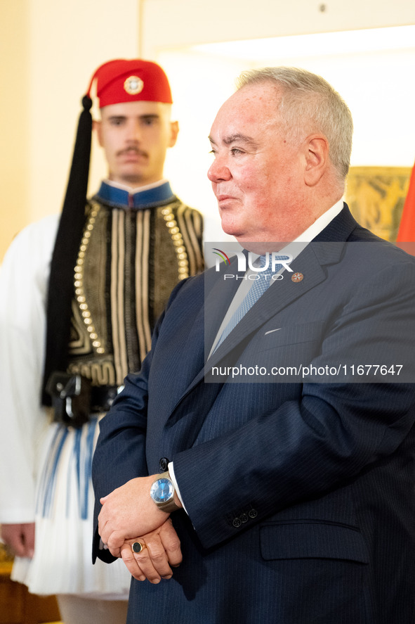 Grand Master and head of the Sovereign Military Order of Malta, Fra' John Timothy Dunlap, and Greek President Katerina Sakellaropoulou excha...