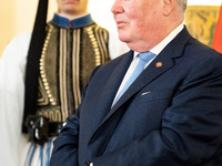 Grand Master and head of the Sovereign Military Order of Malta, Fra' John Timothy Dunlap, and Greek President Katerina Sakellaropoulou excha...