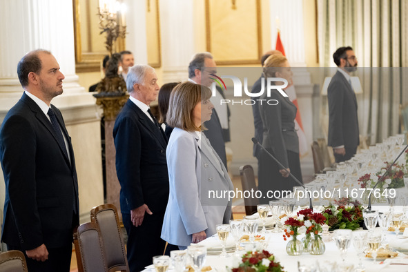 Grand Master and head of the Sovereign Military Order of Malta, Fra' John Timothy Dunlap (not pictured), and the President of Greece, Kateri...