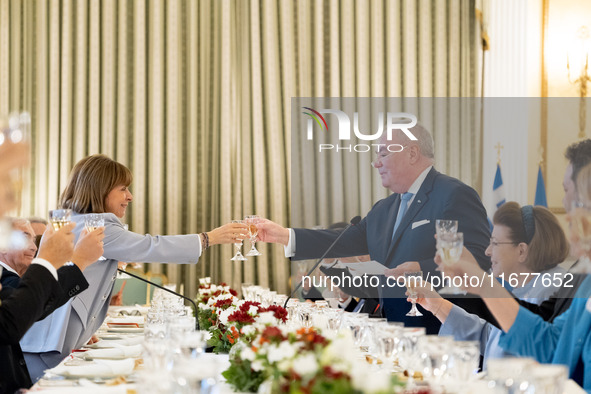 Grand Master and head of the Sovereign Military Order of Malta, Fra' John Timothy Dunlap, and the President of Greece, Katerina Sakellaropou...