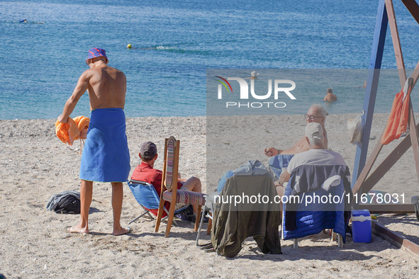 People enjoy the warm weather in Athens, Greece, on October 18, 2024. 