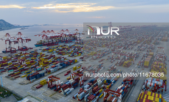 A photo taken in Shanghai, China, on October 18, 2024, shows the operation scene of the Yangshan Deep Water Port area of Shanghai Port. From...