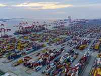 A photo taken in Shanghai, China, on October 18, 2024, shows the operation scene of the Yangshan Deep Water Port area of Shanghai Port. From...